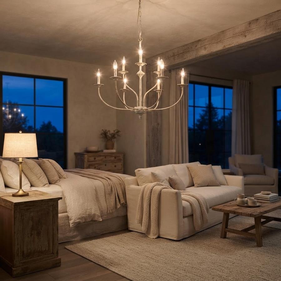 Two-tier candle chandelier lit above a set dining table